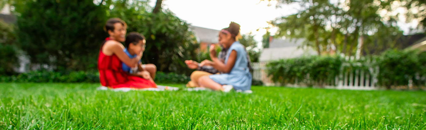 Family enjoying time on the lawn