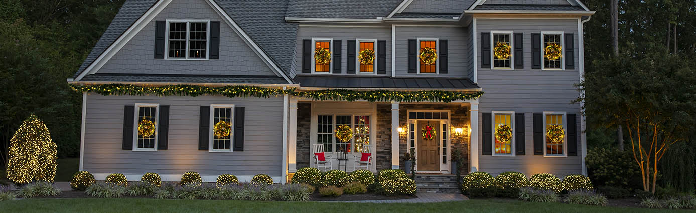 Home with nice lawn decorated for holidays