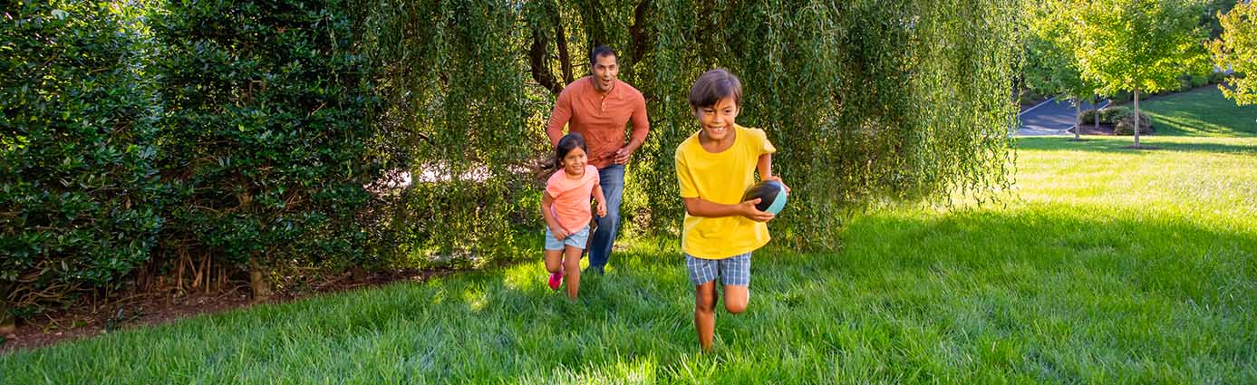 family playing on lawn