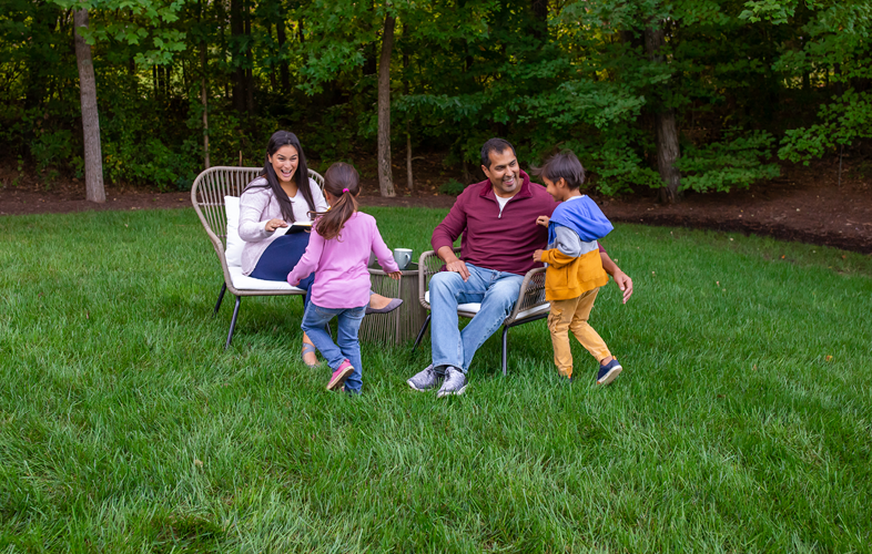 family enjoying time on lawn