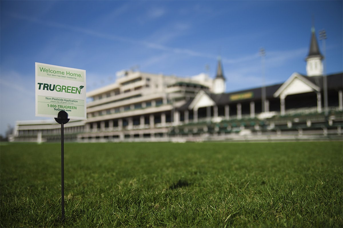 <p>TruGreen Sign with Churchill Downs in the background</p>