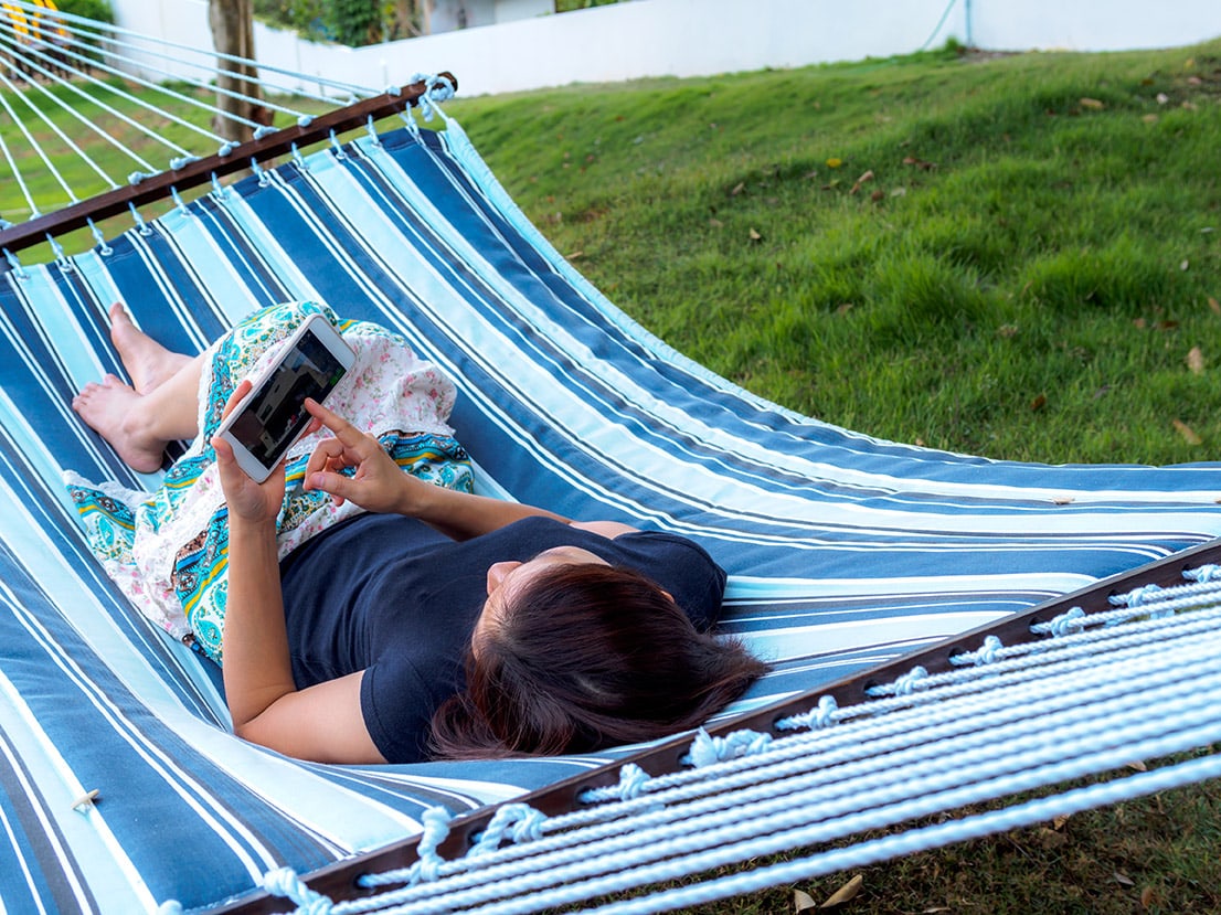 Woman relaxes in hammock