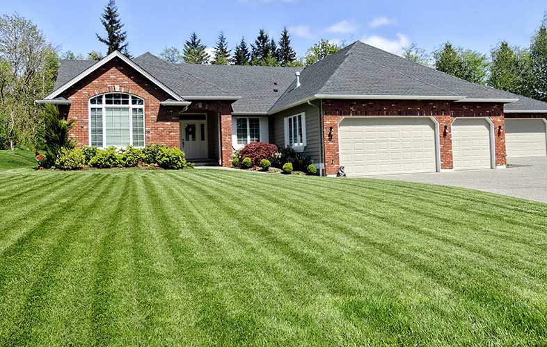 Beautiful home with healthy, green lawn