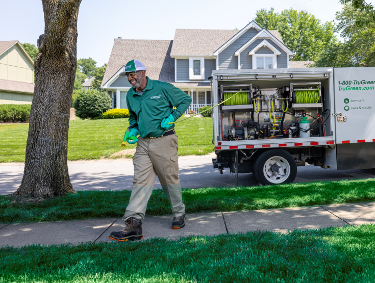 TruGreen specialist treating a lawn
