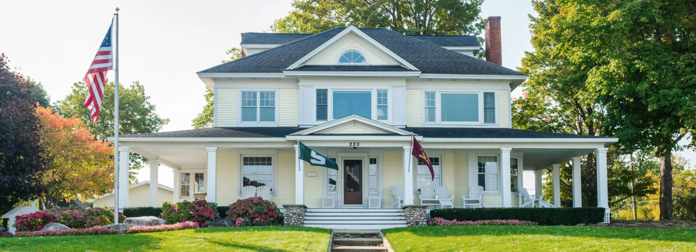 Beautiful home in Michigan with lush, green lawn