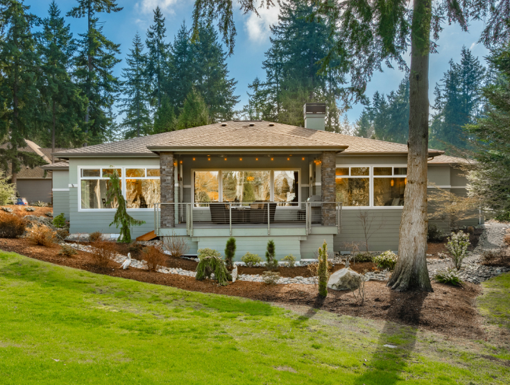 Beautiful home in the Pacific Northwest with a lush, green lawn