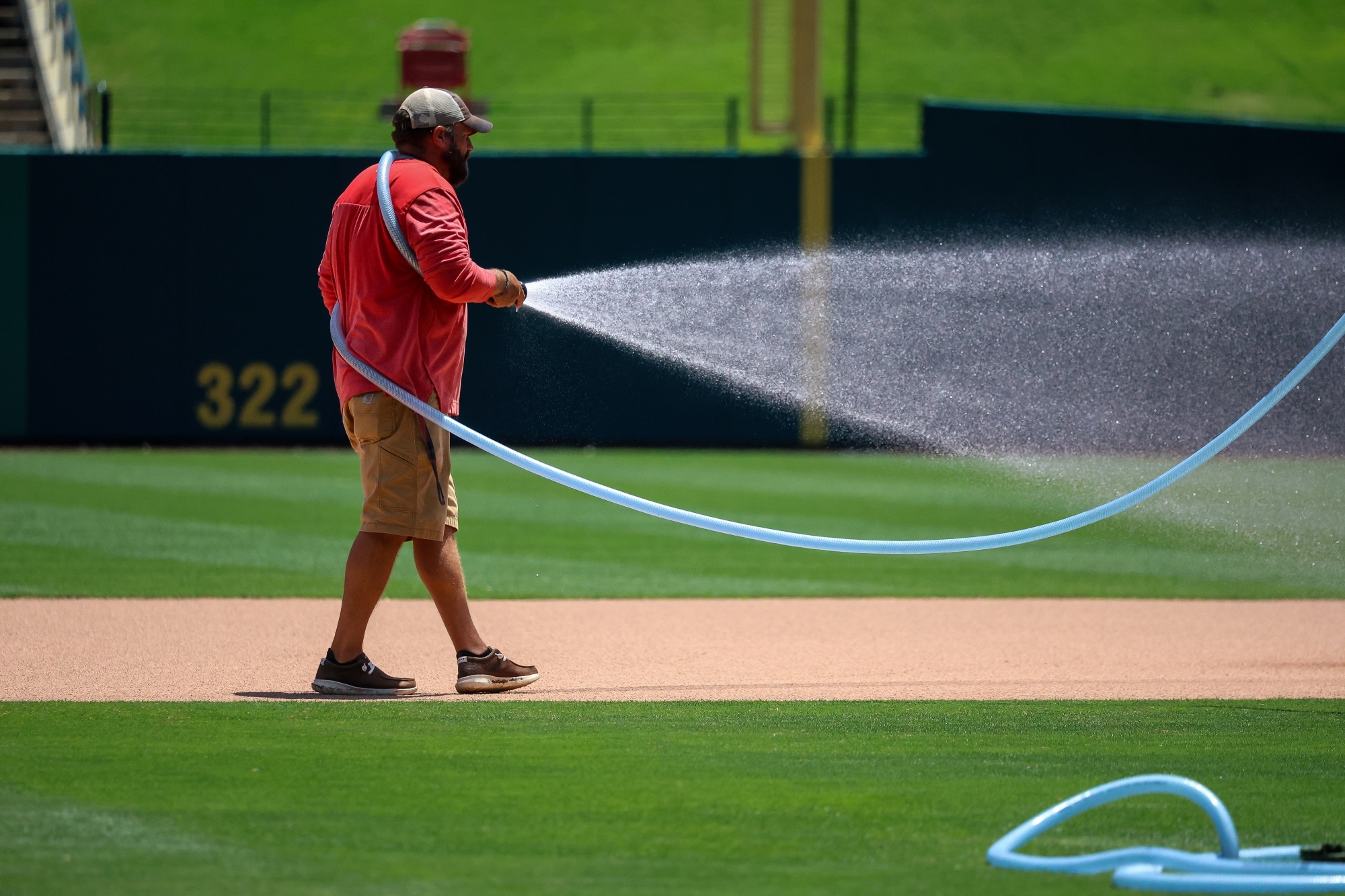 Tylor Meppelink, Head Groundskeeper for the Memphis Redbirds watering the field at AutoZone Park