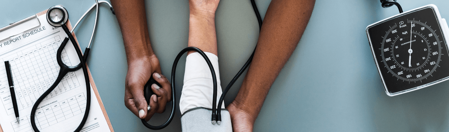 Nurse taking someone's blood pressure