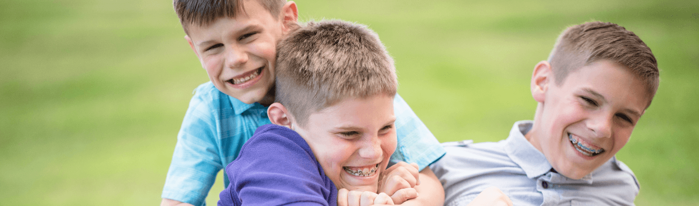 Young boys playing on a lawn
