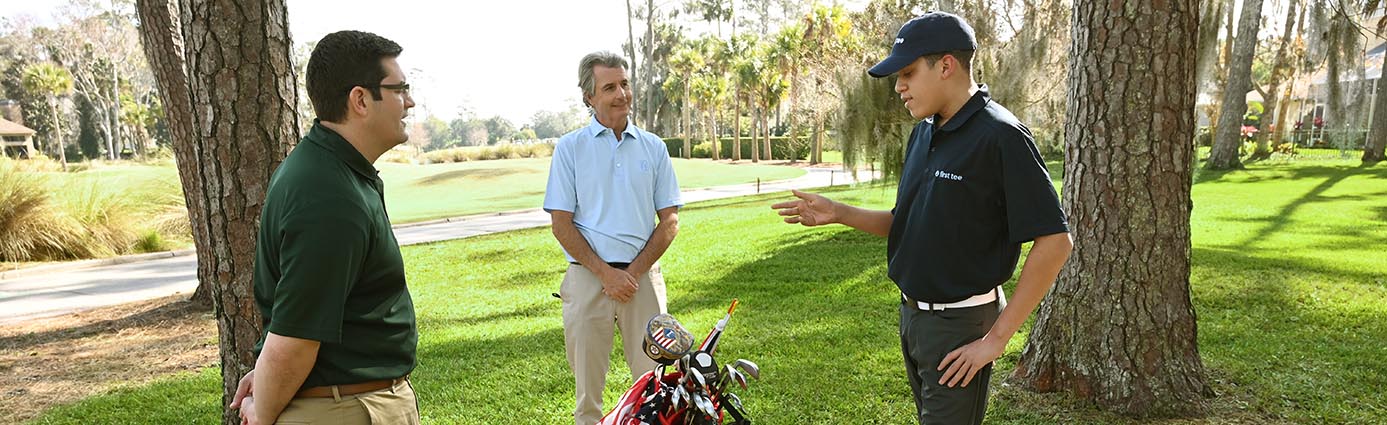 First Tee student with PGA TOUR agronomist and TruGreen agronomist