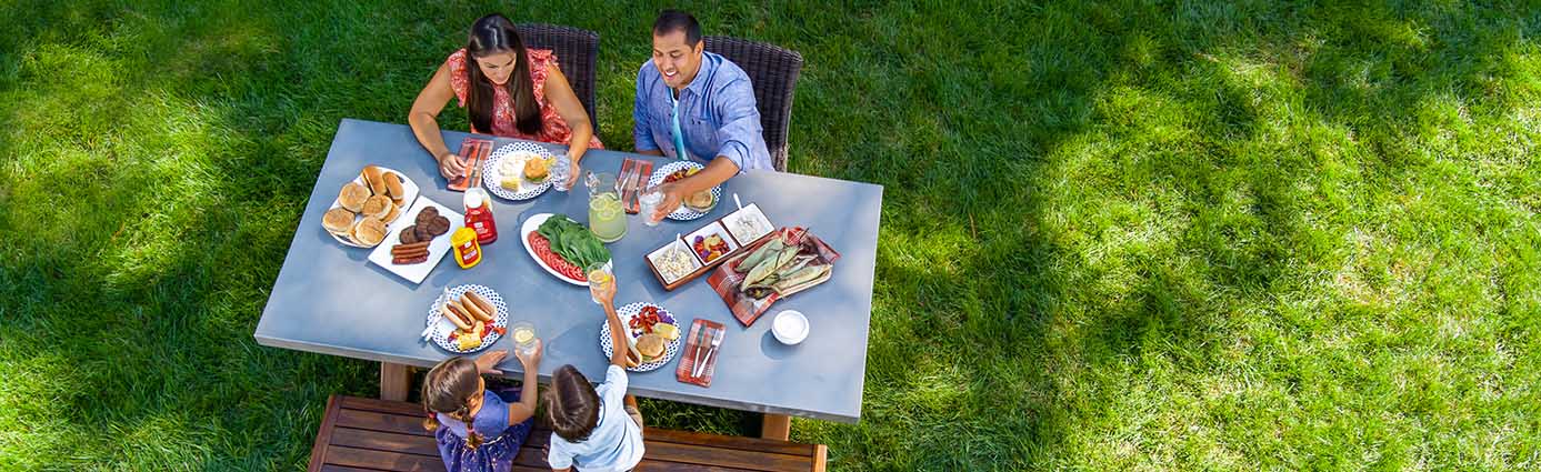 Family enjoying picnic on lawn