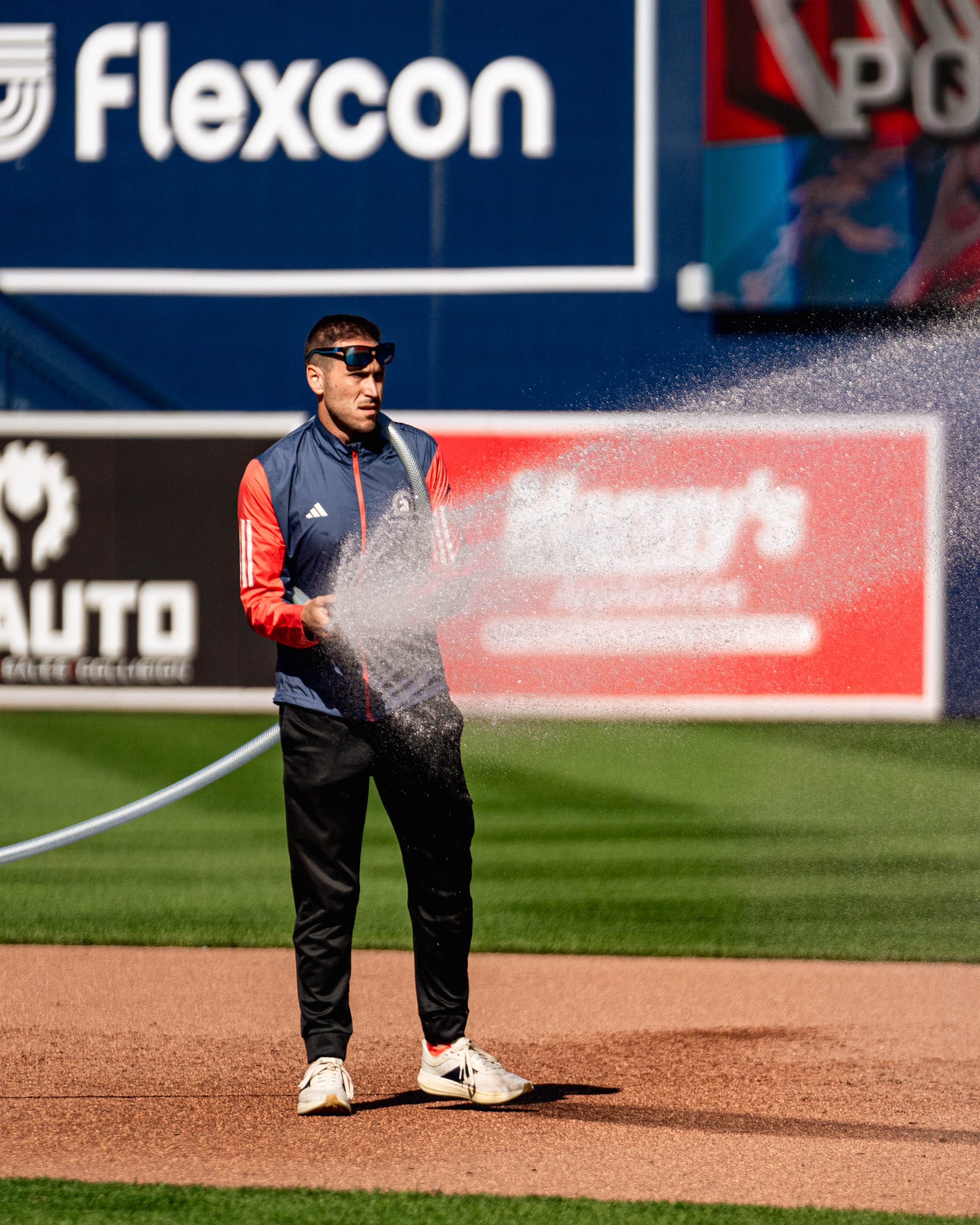 Ryan Lefler, Field Superintendent of the Worcester Red Sox at Polar Park watering the field